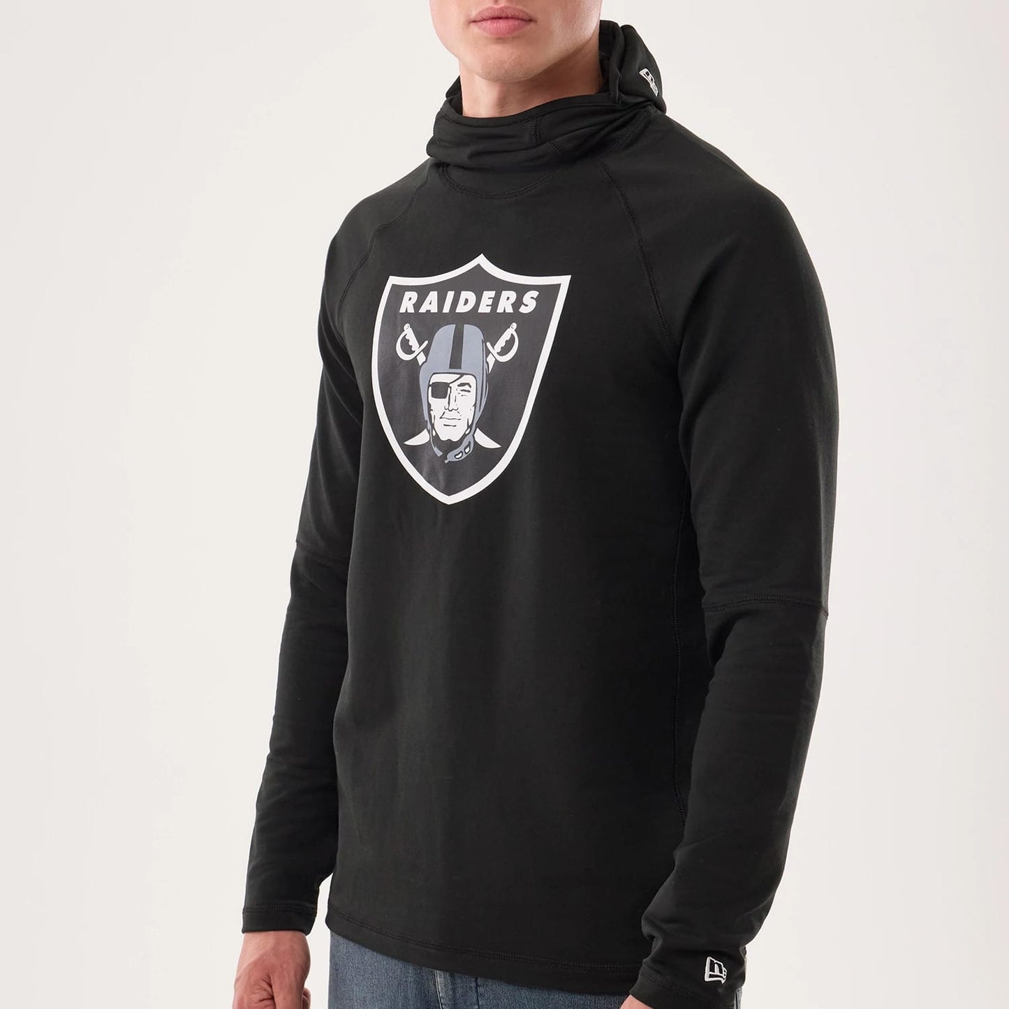 The model is wearing this NFL Sideline 2026 Las Vegas Raiders Balaclava Hoodie in black. 5