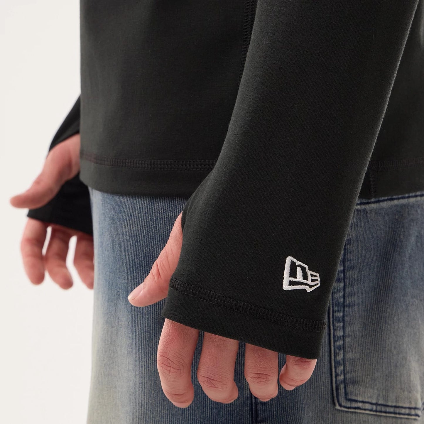 The model is wearing this NFL Sideline 2026 Las Vegas Raiders Balaclava Hoodie in black. 4