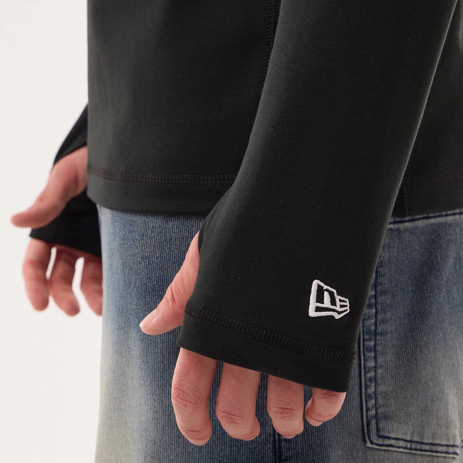 The model is wearing this NFL Sideline 2026 Las Vegas Raiders Balaclava Hoodie in black. 4