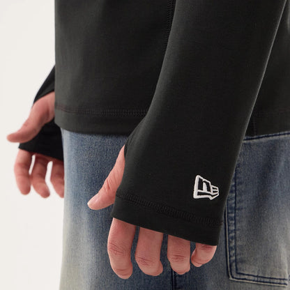 The model is wearing this NFL Sideline 2026 Las Vegas Raiders Balaclava Hoodie in black. 4