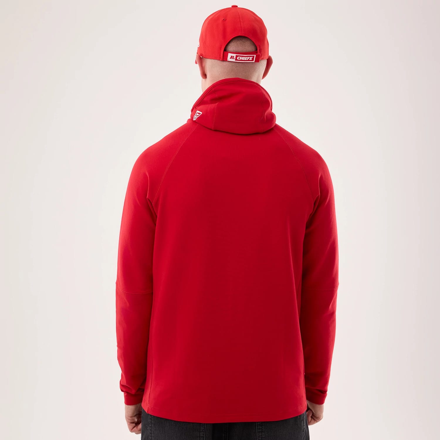 The model is wearing this NFL Sideline 2026 Kansas City Chiefs Balaclava Hoodie in red. 2