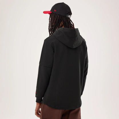 The model is wearing this NFL Sideline 2026 San Francisco 49ers Double Sleeve Hoodie in black. 2
