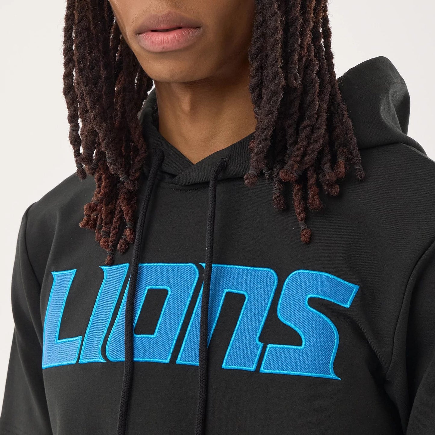 The model is wearing this NFL Sideline 2026 Detroit Lions Double Sleeve Hoodie in black. 4