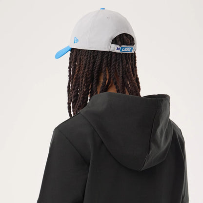 The model is wearing this NFL Sideline 2026 Detroit Lions Double Sleeve Hoodie in black. 7