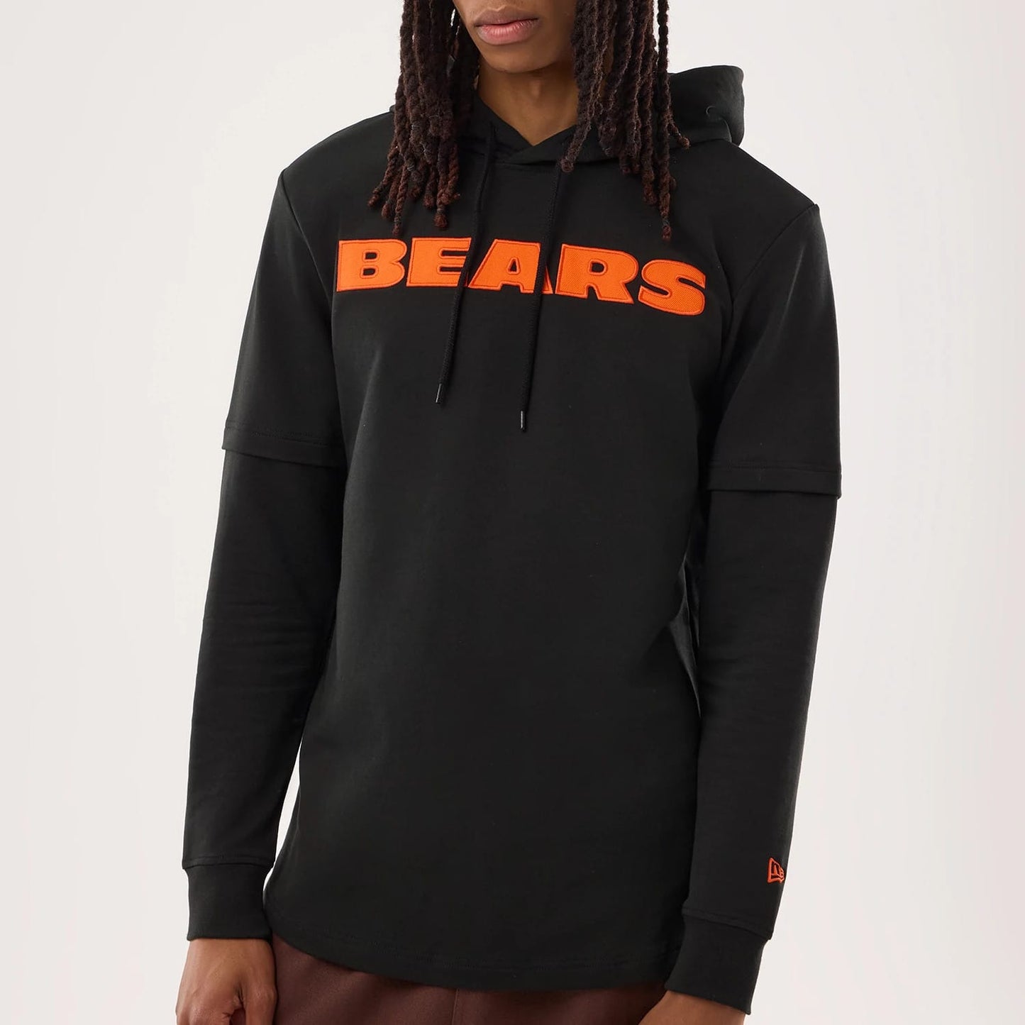 The model is wearing this NFL Sideline 2026 Chicago Bears Double Sleeve Hoodie in black. 3