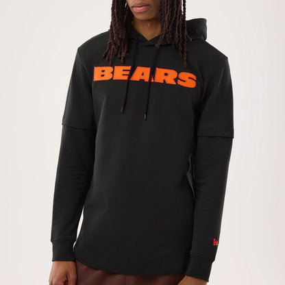 The model is wearing this NFL Sideline 2026 Chicago Bears Double Sleeve Hoodie in black. 3