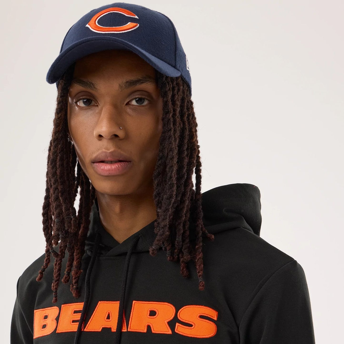 The model is wearing this NFL Sideline 2026 Chicago Bears Double Sleeve Hoodie in black. 5