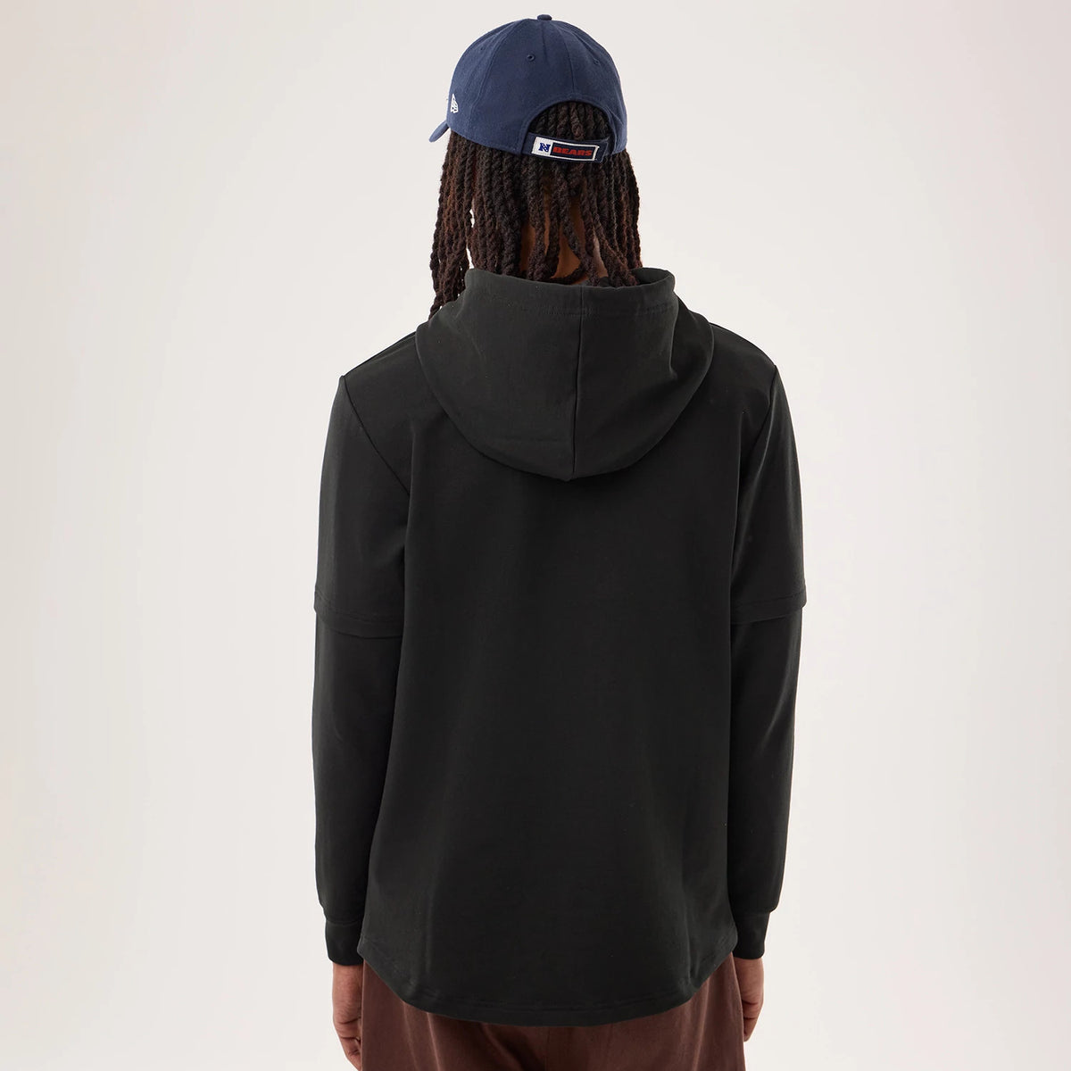 The model is wearing this NFL Sideline 2026 Chicago Bears Double Sleeve Hoodie in black. 2