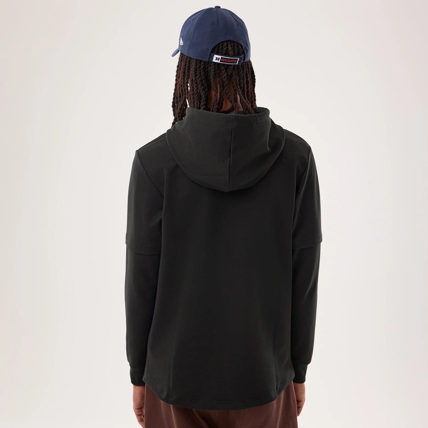 The model is wearing this NFL Sideline 2026 Chicago Bears Double Sleeve Hoodie in black. 2