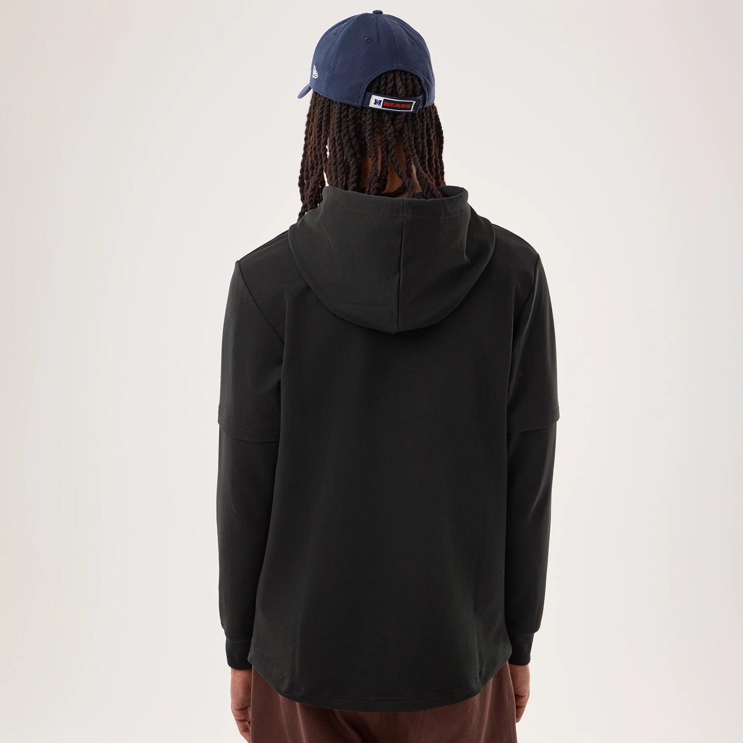 The model is wearing this NFL Sideline 2026 Chicago Bears Double Sleeve Hoodie in black. 2