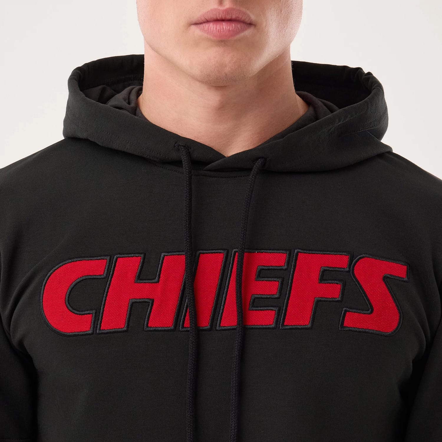 The model is wearing this NFL Sideline 2026 Kansas City Chiefs Double Sleeve Hoodie in black. 4