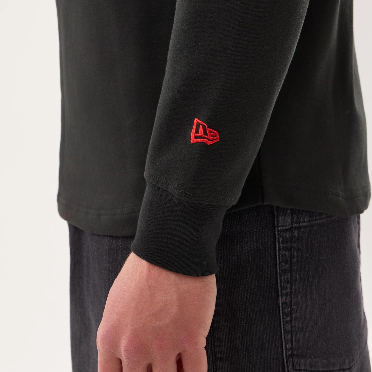 The model is wearing this NFL Sideline 2026 Kansas City Chiefs Double Sleeve Hoodie in black. 5