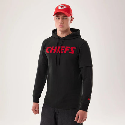 The model is wearing this NFL Sideline 2026 Kansas City Chiefs Double Sleeve Hoodie in black. 1
