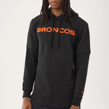 The model is wearing this NFL Sideline 2026 Denver Broncos Double Sleeve Hoodie in black. 4
