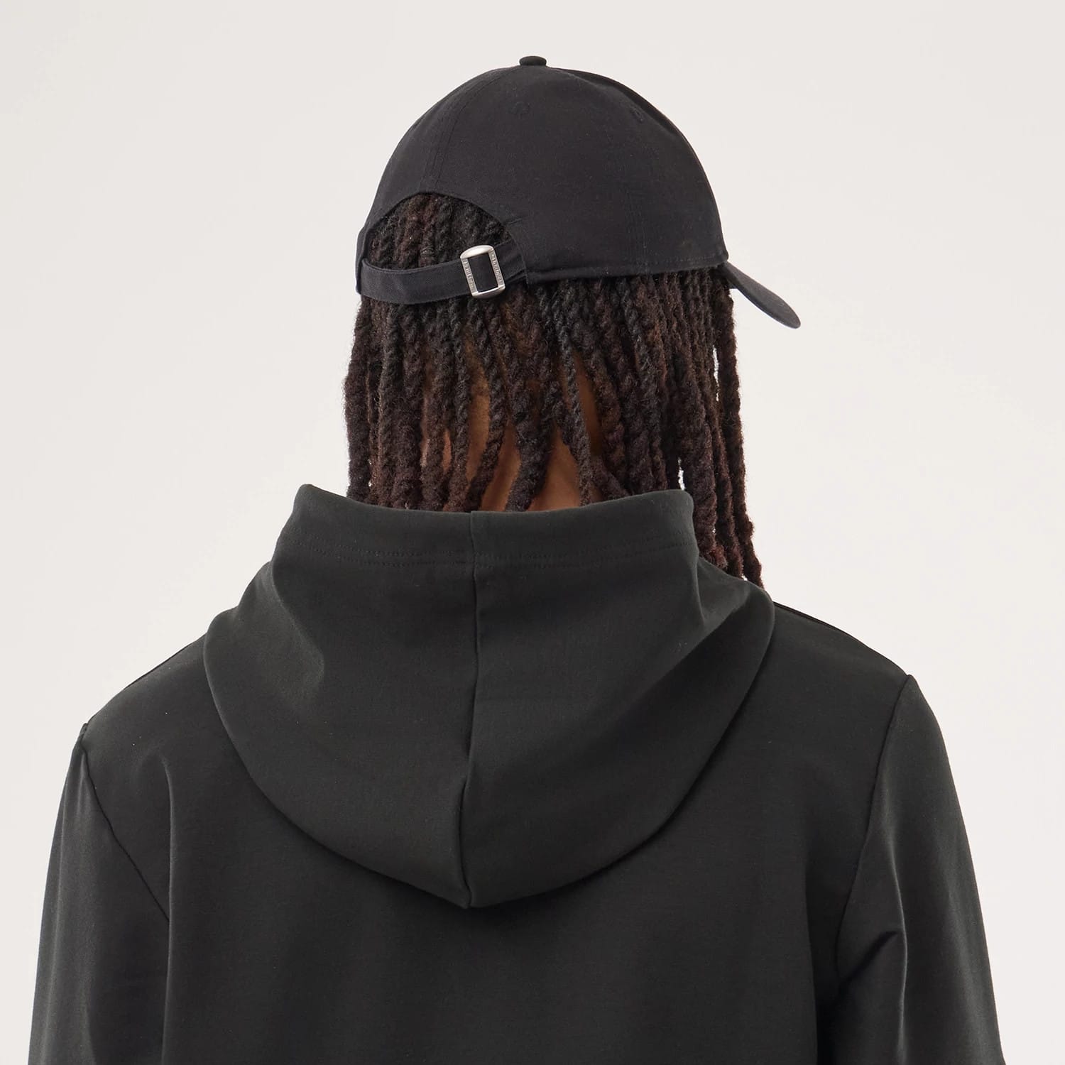 The model is wearing this NFL Sideline 2026 Denver Broncos Double Sleeve Hoodie in black. 7