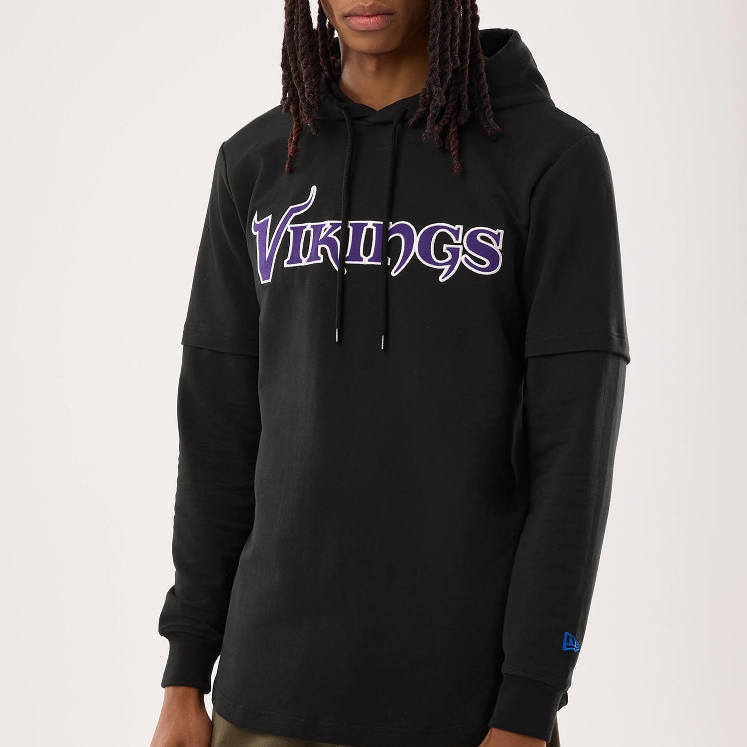 The model is wearing this NFL Sideline 2026 Minnesota Vikings Double Sleeve Hoodie in black. 4