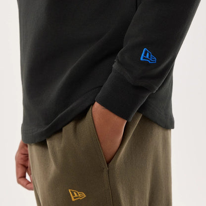 The model is wearing this NFL Sideline 2026 Minnesota Vikings Double Sleeve Hoodie in black. 6
