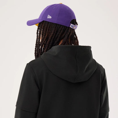 The model is wearing this NFL Sideline 2026 Minnesota Vikings Double Sleeve Hoodie in black. 7