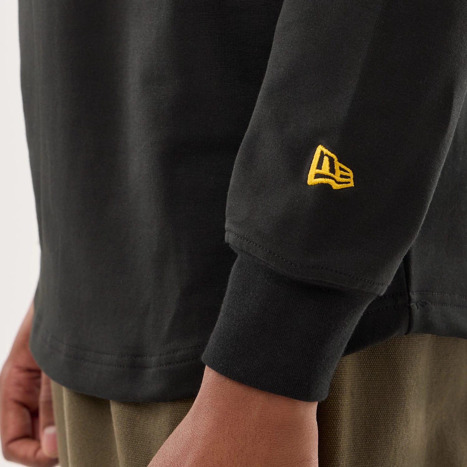 The model is wearing this NFL Sideline 2026 Pittsburgh Steelers Double Sleeve Hoodie in black. 6