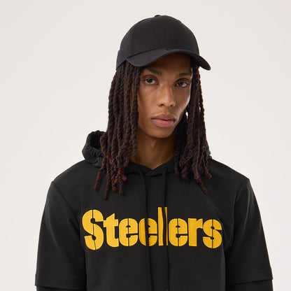 The model is wearing this NFL Sideline 2026 Pittsburgh Steelers Double Sleeve Hoodie in black. 5