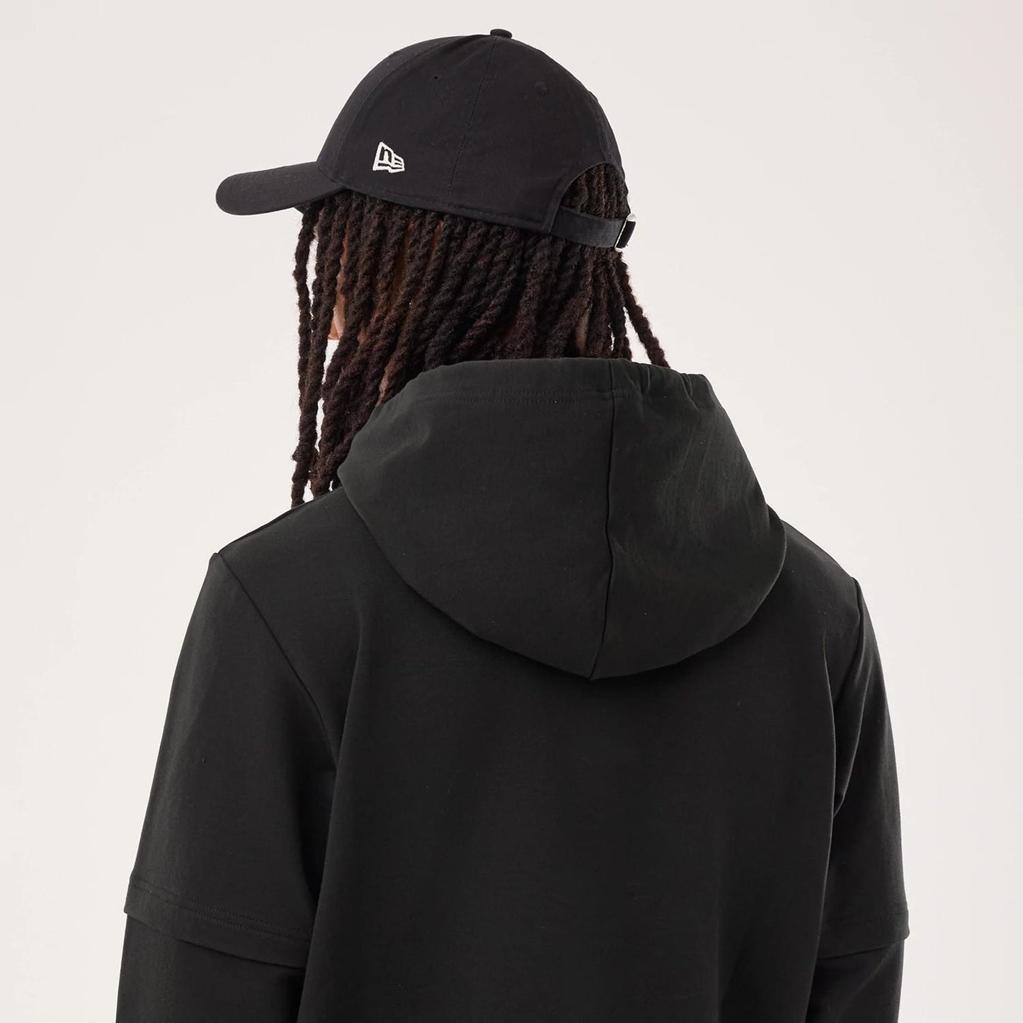 The model is wearing this NFL Sideline 2026 Pittsburgh Steelers Double Sleeve Hoodie in black. 7