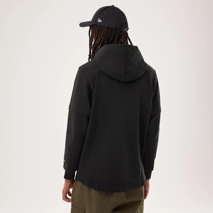 The model is wearing this NFL Sideline 2026 Pittsburgh Steelers Double Sleeve Hoodie in black. 2