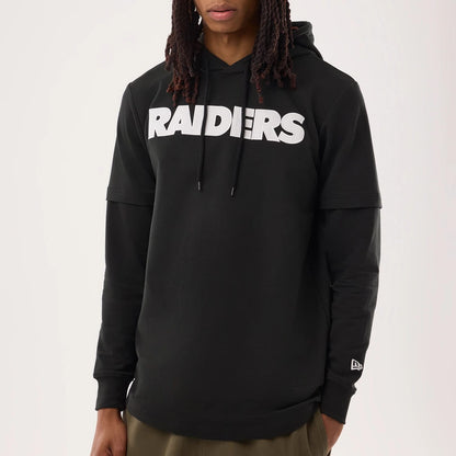The model is wearing this NFL Sideline 2026 Las Vegas Raiders Double Sleeve Hoodie in black. 4