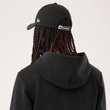 The model is wearing this NFL Sideline 2026 Las Vegas Raiders Double Sleeve Hoodie in black. 7