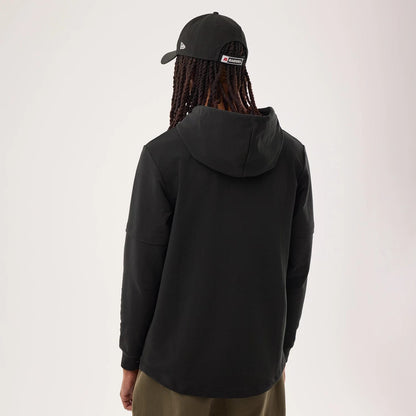 The model is wearing this NFL Sideline 2026 Las Vegas Raiders Double Sleeve Hoodie in black. 2