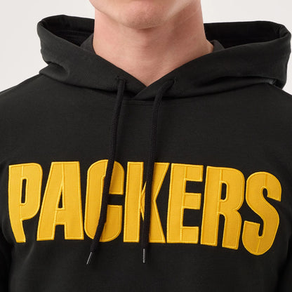 The model is wearing this NFL Sideline 2026 Green Bay Packers Double Sleeve Hoodie in black. 4