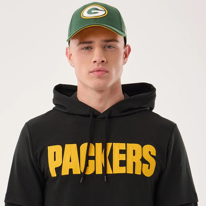 The model is wearing this NFL Sideline 2026 Green Bay Packers Double Sleeve Hoodie in black. 6