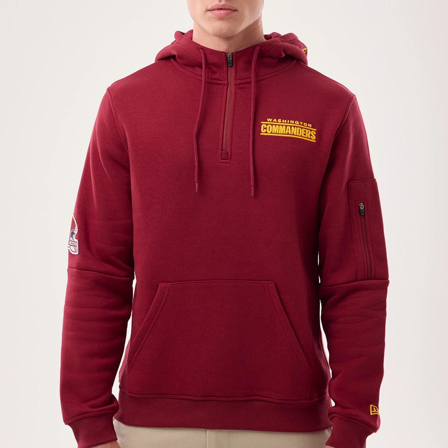 The model is wearing this NFL Sideline 2026 Washington Commanders Pullover Hoodie in dark red. 3