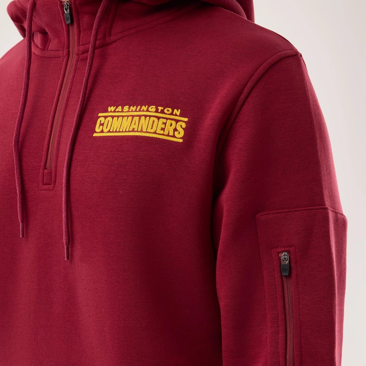 The model is wearing this NFL Sideline 2026 Washington Commanders Pullover Hoodie in dark red. 4