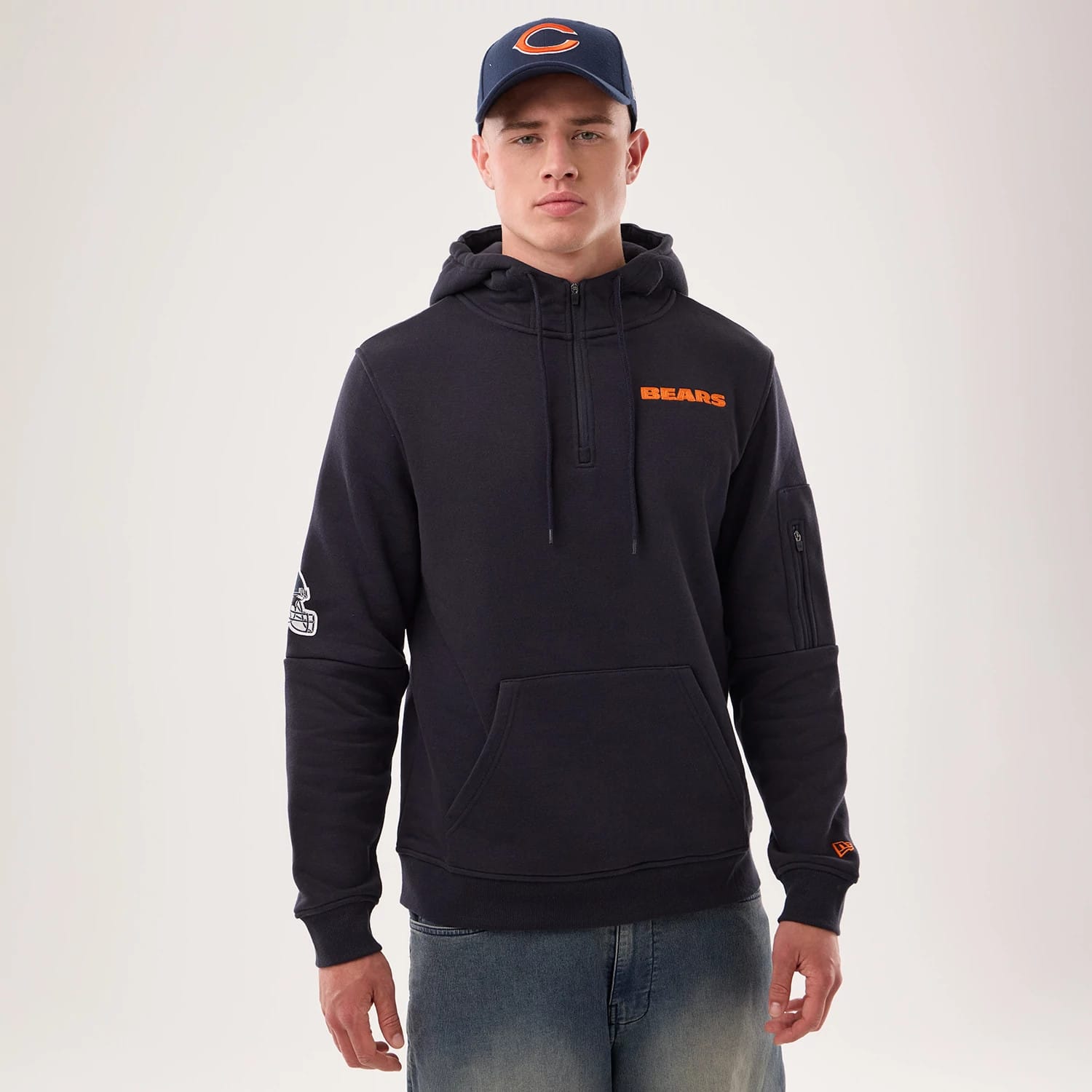 The model is wearing this NFL Sideline 2026 Chicago Bears Pullover Hoodie in navy. 1