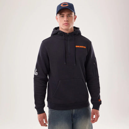 The model is wearing this NFL Sideline 2026 Chicago Bears Pullover Hoodie in navy. 1