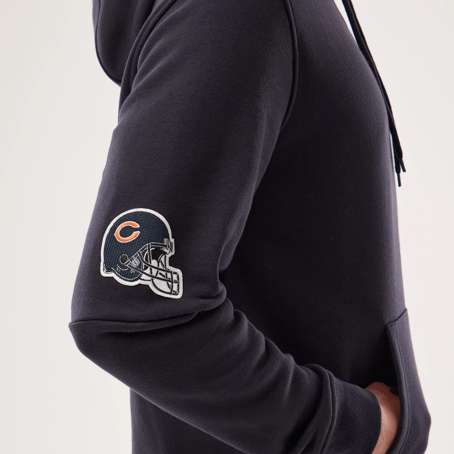 The model is wearing this NFL Sideline 2026 Chicago Bears Pullover Hoodie in navy. 4