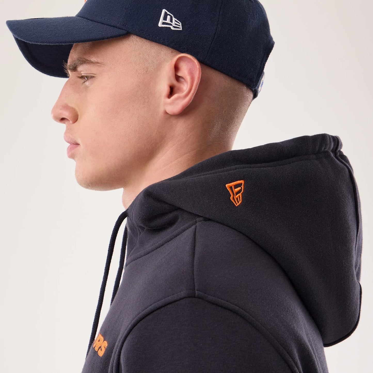 The model is wearing this NFL Sideline 2026 Chicago Bears Pullover Hoodie in navy. 7