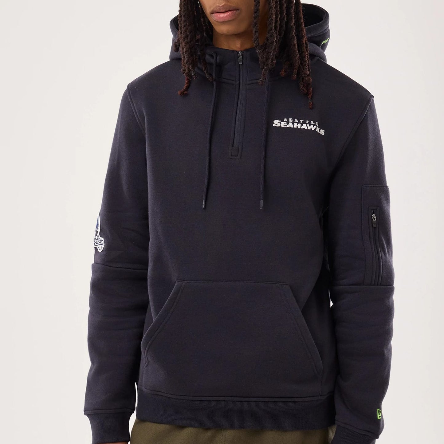 The model is wearing this NFL Sideline 2026 Seattle Seahawks Pullover Hoodie in navy. 3