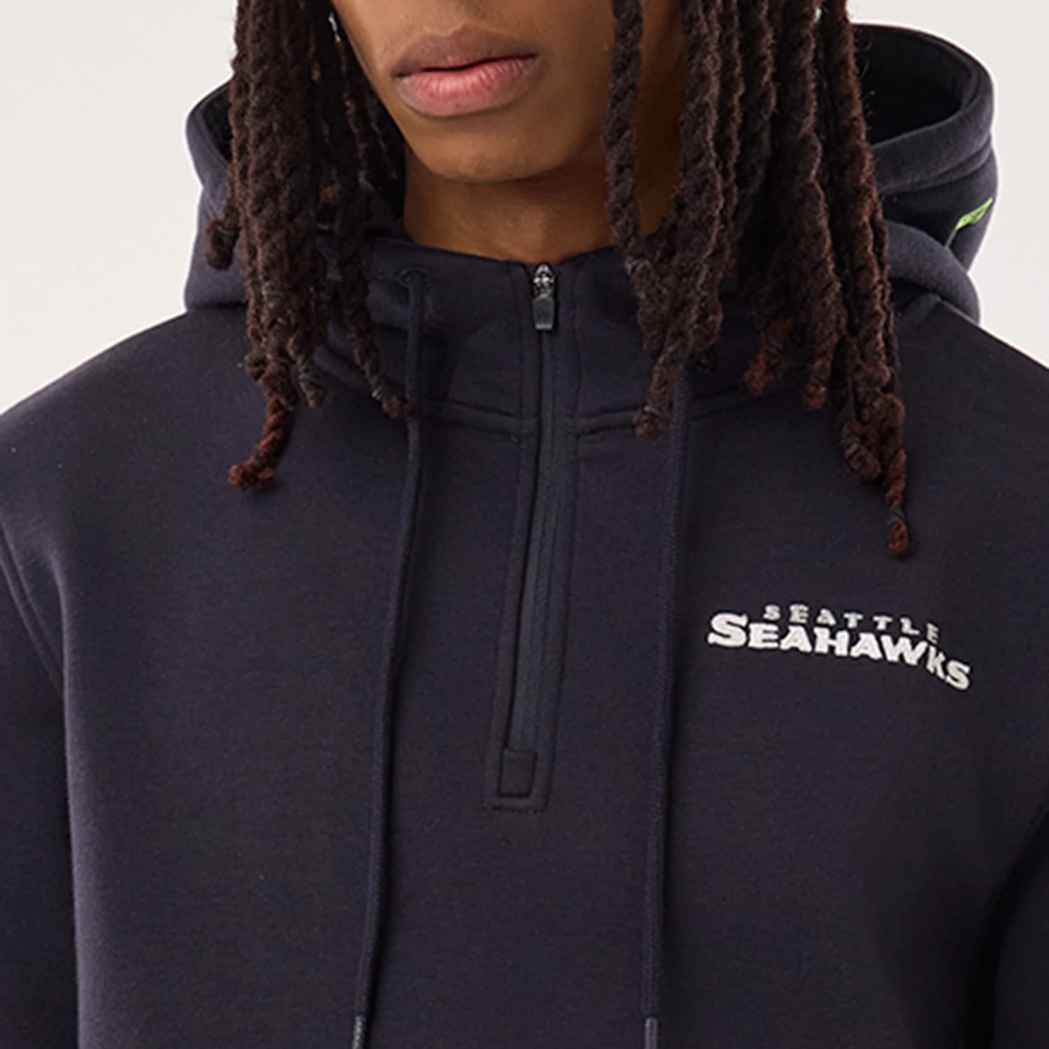 The model is wearing this NFL Sideline 2026 Seattle Seahawks Pullover Hoodie in navy. 7