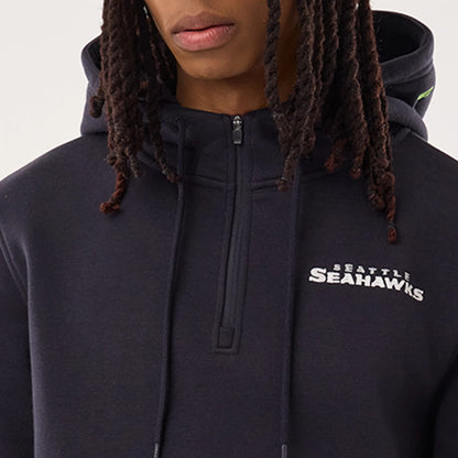 The model is wearing this NFL Sideline 2026 Seattle Seahawks Pullover Hoodie in navy. 7
