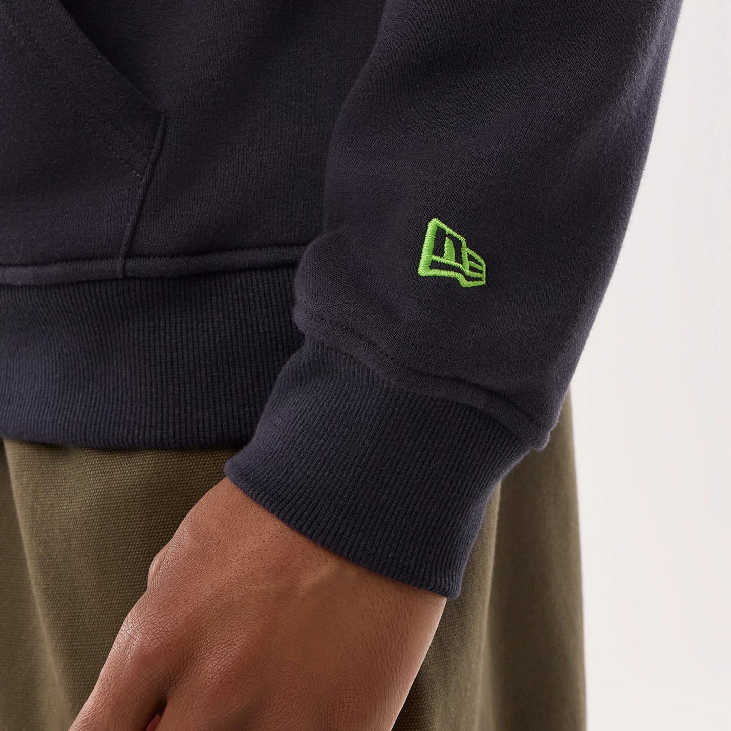 The model is wearing this NFL Sideline 2026 Seattle Seahawks Pullover Hoodie in navy. 6