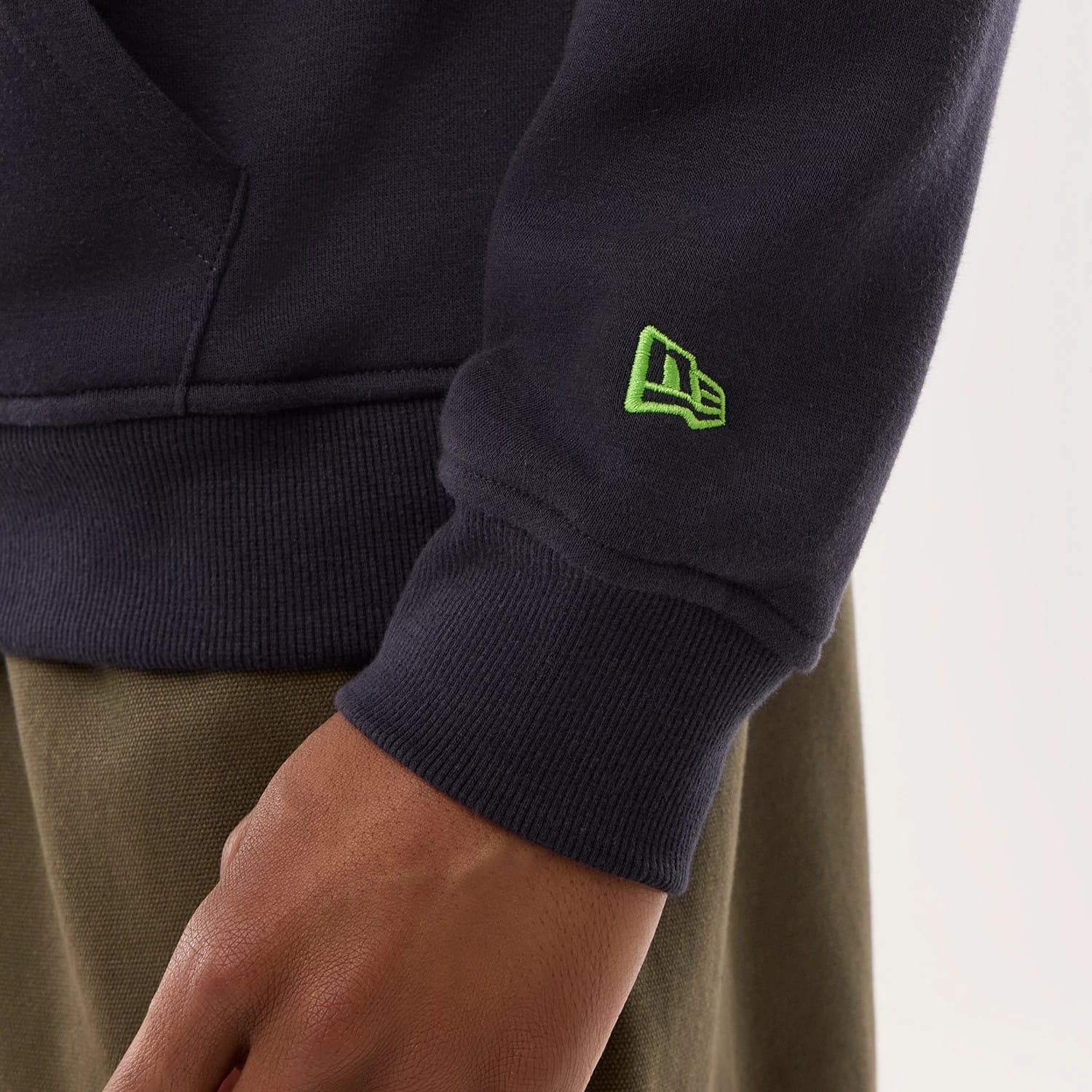 The model is wearing this NFL Sideline 2026 Seattle Seahawks Pullover Hoodie in navy. 6