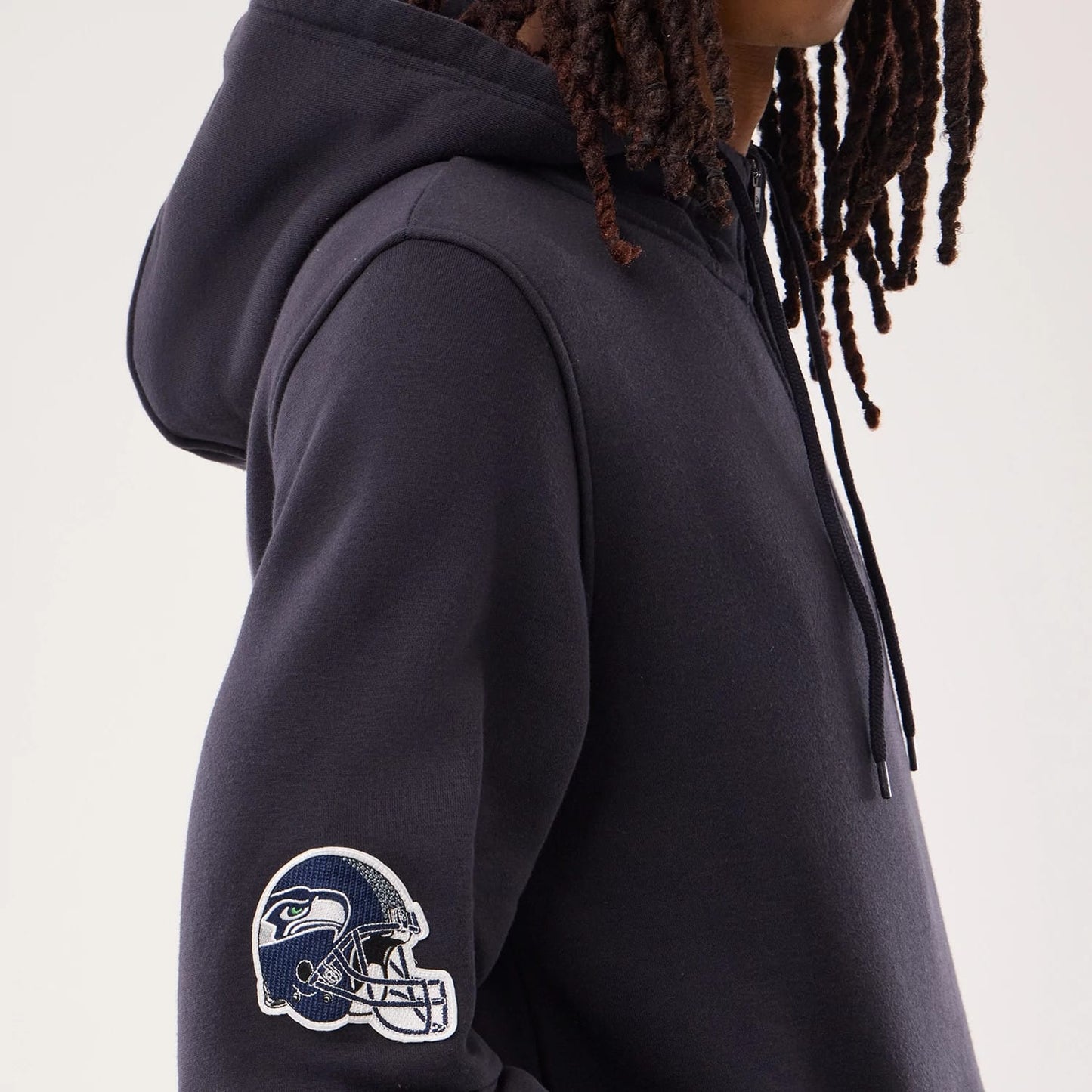 The model is wearing this NFL Sideline 2026 Seattle Seahawks Pullover Hoodie in navy. 4