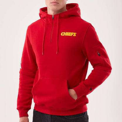 The model is wearing this NFL Sideline 2026 Kansas City Chiefs Pullover Hoodie in red. 3
