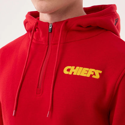 The model is wearing this NFL Sideline 2026 Kansas City Chiefs Pullover Hoodie in red. 6