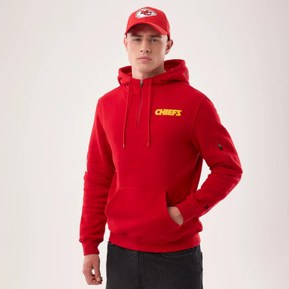 The model is wearing this NFL Sideline 2026 Kansas City Chiefs Pullover Hoodie in red. 1