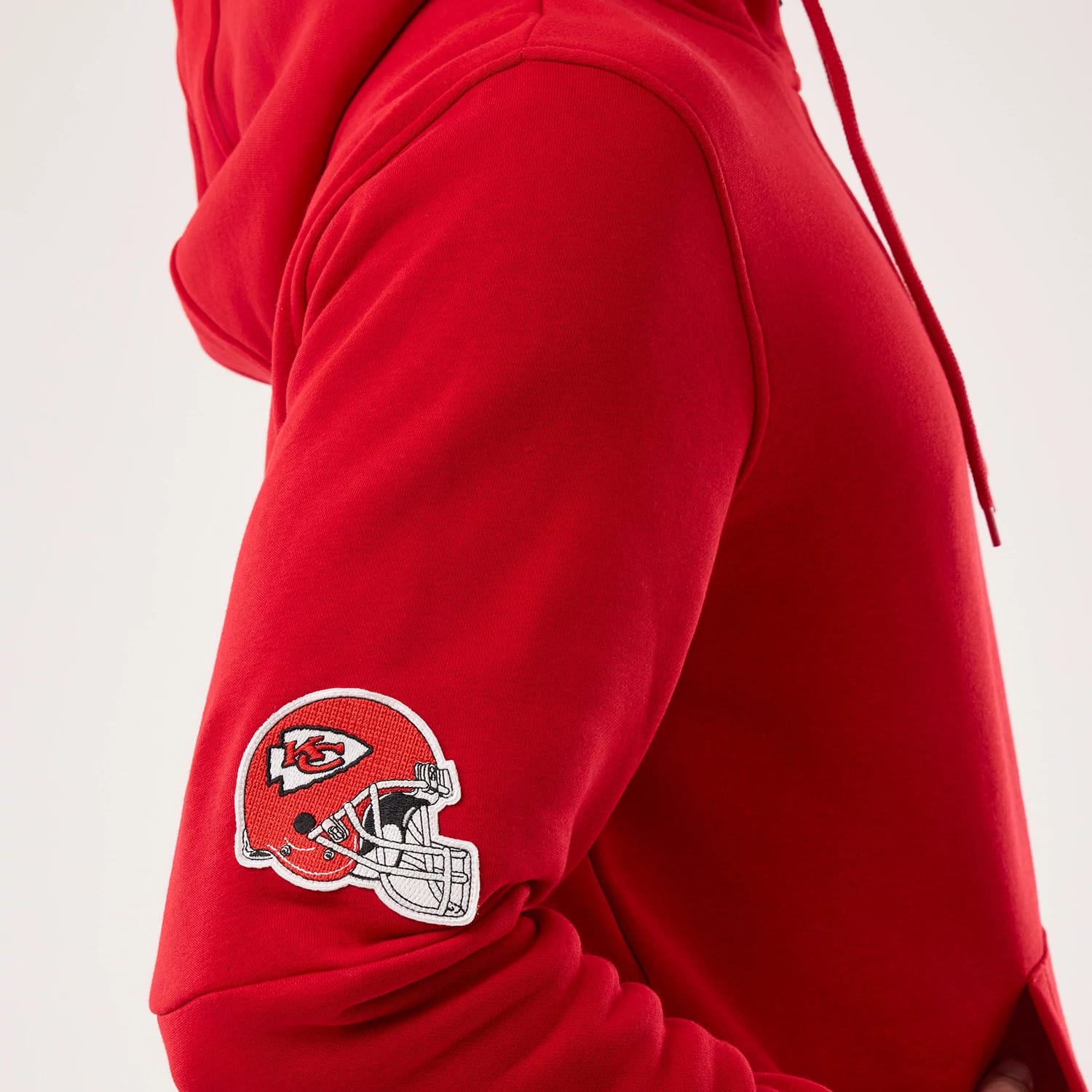 The model is wearing this NFL Sideline 2026 Kansas City Chiefs Pullover Hoodie in red. 4