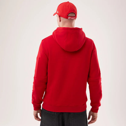 The model is wearing this NFL Sideline 2026 Kansas City Chiefs Pullover Hoodie in red. 2