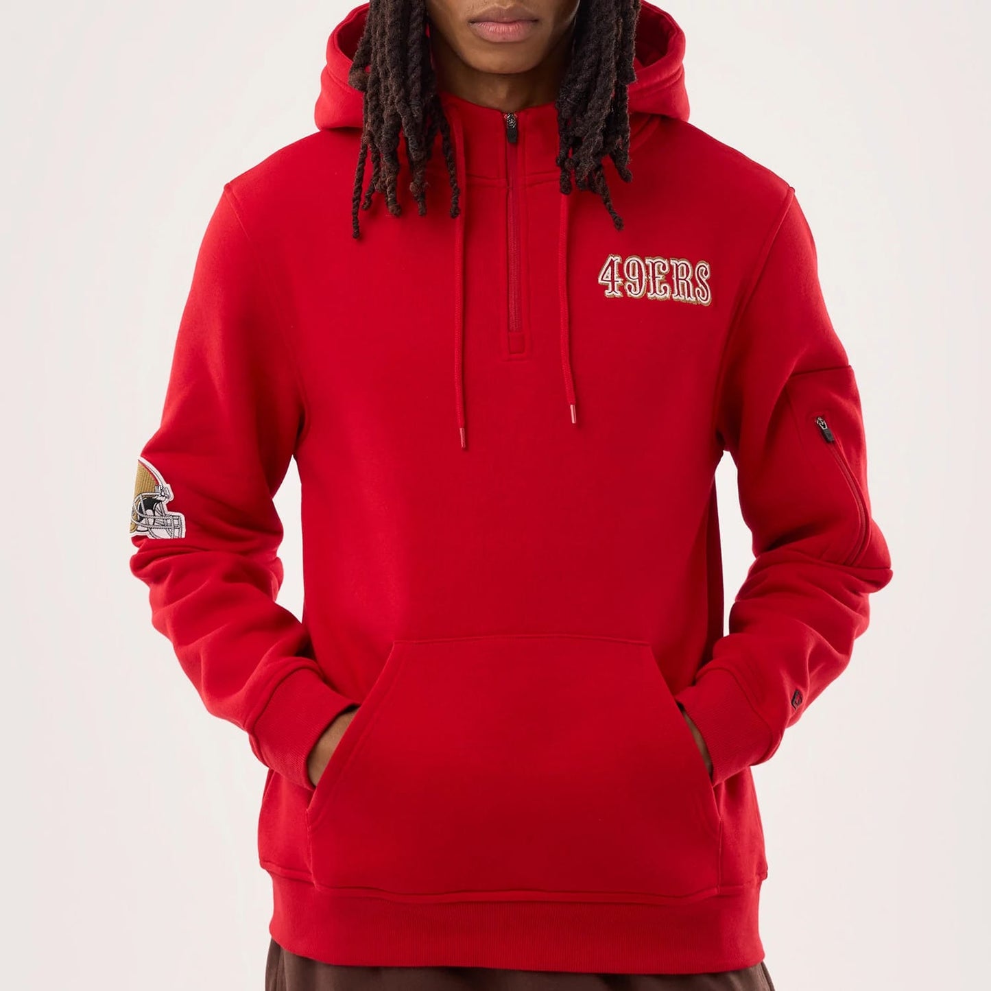 The model is wearing this NFL Sideline 2026 San Francisco 49ers Pullover Hoodie in red. 3
