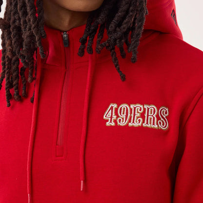 The model is wearing this NFL Sideline 2026 San Francisco 49ers Pullover Hoodie in red. 6